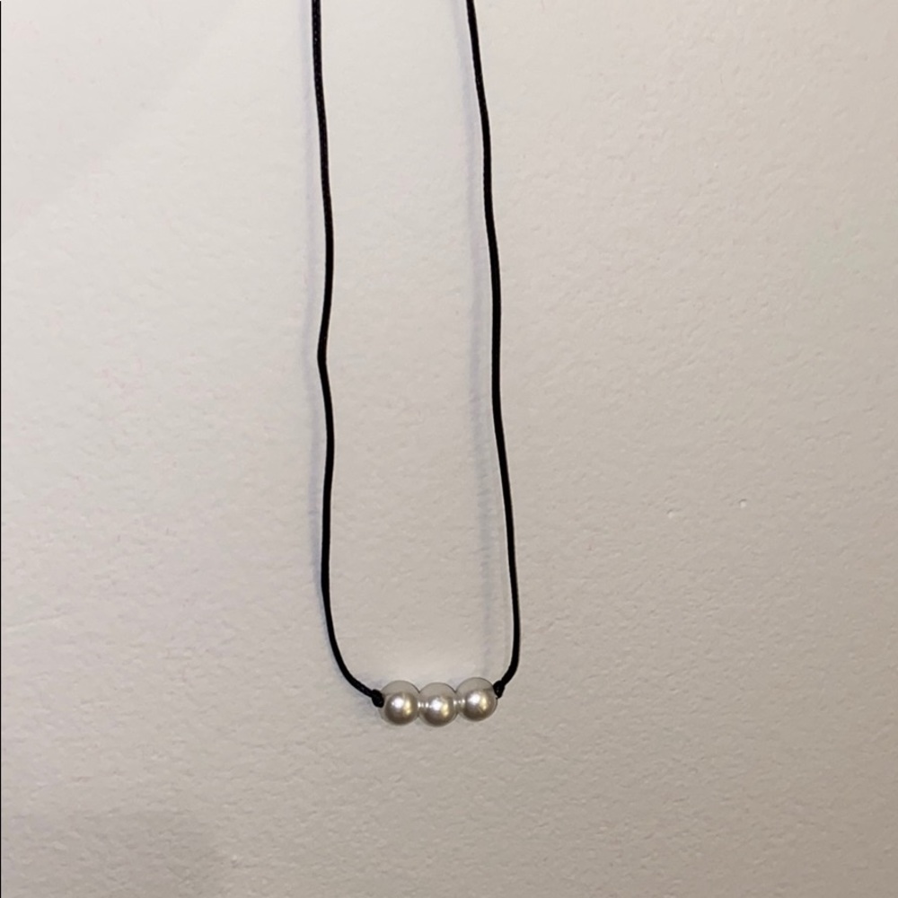 Three pearl necklace